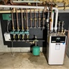 Completed high-efficiency boiler retrofit with updated piping and heating components in a Saratoga home