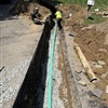 Completed sewer line installation before backfilling at a residential property in Clifton Park