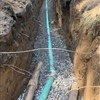 Newly installed residential sewer pipe with gravel base during a Clifton Park sewer line replacement